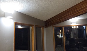 Beautiful bright wall mounted light fixtures in open concept house.